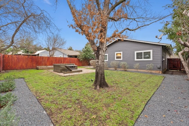 view of yard featuring a patio area and a fenced backyard