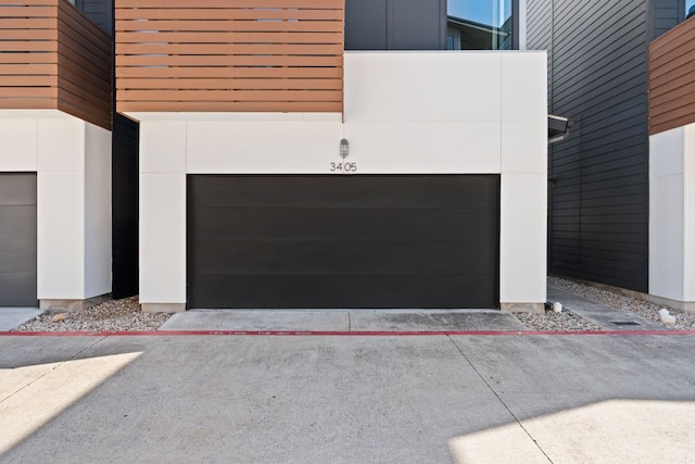 garage featuring driveway