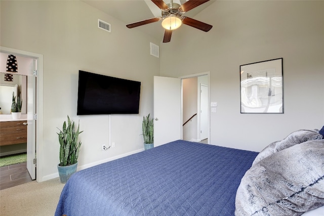 bedroom with a ceiling fan, light colored carpet, visible vents, and baseboards