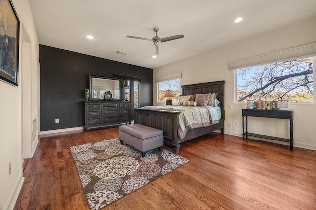 bedroom featuring baseboards, visible vents, a ceiling fan, wood finished floors, and recessed lighting