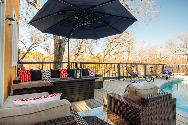 wooden deck with a fenced in pool and outdoor lounge area