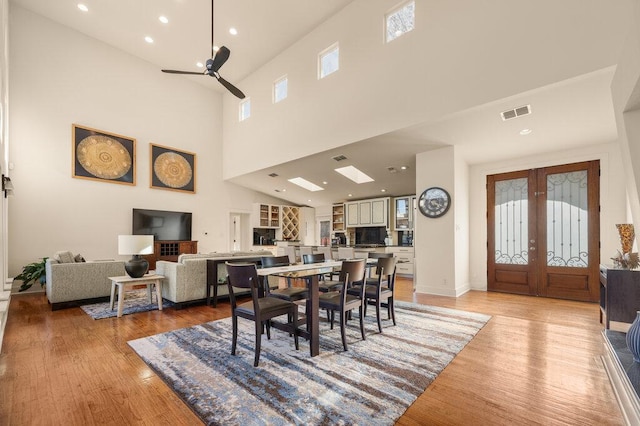 dining area featuring recessed lighting, a ceiling fan, visible vents, light wood-style floors, and french doors