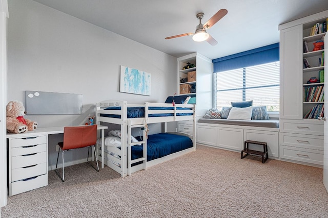 bedroom with a ceiling fan and light carpet