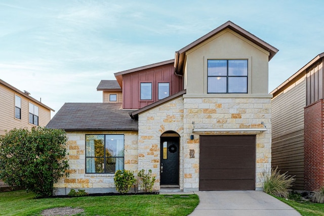 view of front facade with a garage, a front lawn, board and batten siding, and concrete driveway