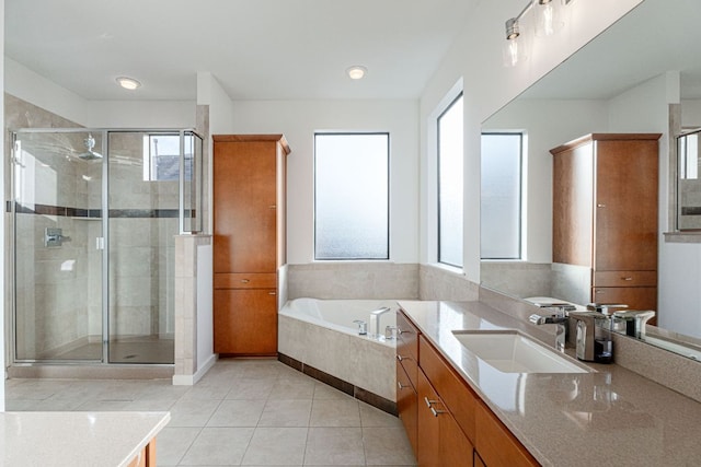 full bath with a bath, a stall shower, tile patterned flooring, and vanity