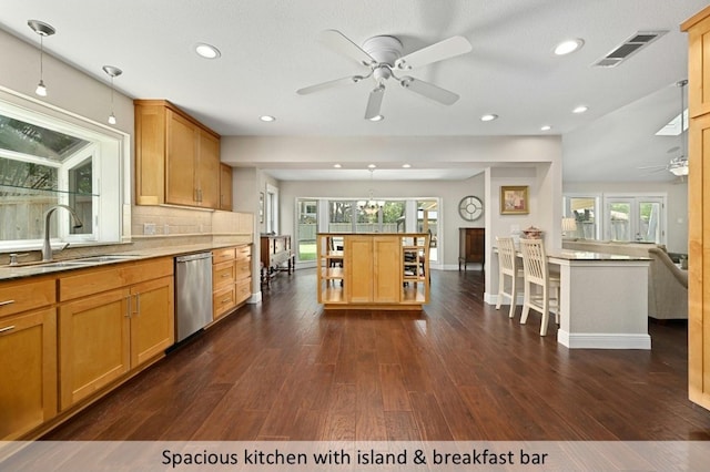 kitchen with a sink, visible vents, dishwasher, open shelves, and decorative light fixtures