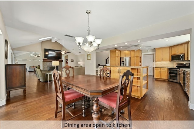 dining room featuring visible vents, wood-type flooring, vaulted ceiling with beams, a fireplace, and ceiling fan with notable chandelier