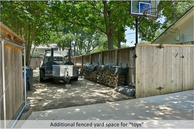 view of car parking with fence