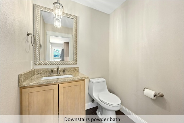 9903 Richelieu Rd, Austin, TX 78750 - half bath with vanity, tile patterned flooring, baseboards, and toilet