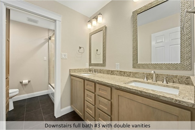 full bath with tile patterned flooring, enclosed tub / shower combo, a sink, and toilet