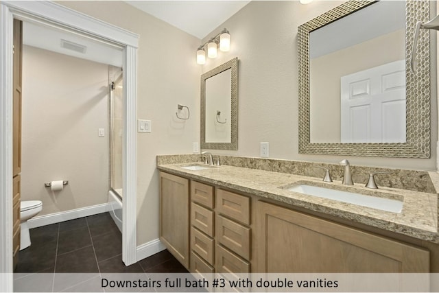 9903 Richelieu Rd, Austin, TX 78750 - full bathroom featuring double vanity, toilet, tile patterned floors, and a sink