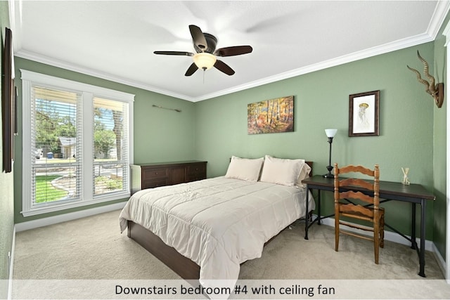 bedroom featuring light carpet, a ceiling fan, baseboards, and crown molding