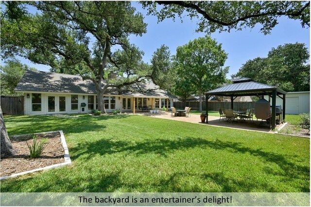 9903 Richelieu Rd, Austin, TX 78750 - back of property with fence, a gazebo, a yard, and a patio area