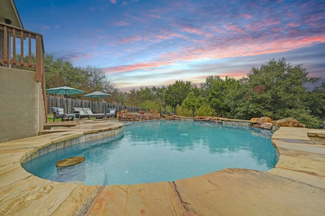 view of swimming pool featuring a fenced in pool, a patio area, and fence