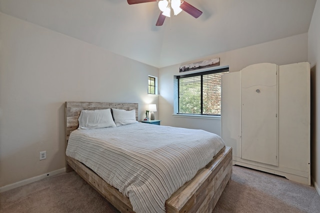 bedroom featuring baseboards, ceiling fan, light colored carpet, and vaulted ceiling