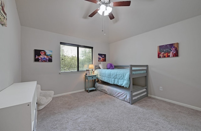bedroom featuring baseboards, ceiling fan, carpet, and lofted ceiling