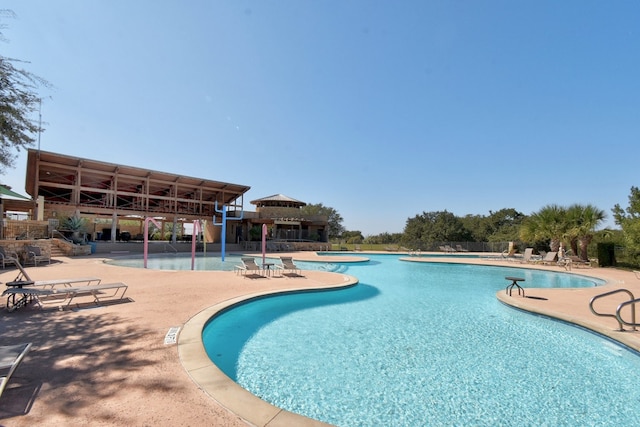 pool with a patio area