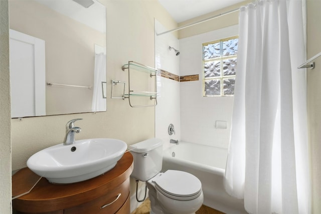 full bathroom featuring vanity, toilet, and shower / bathtub combination with curtain