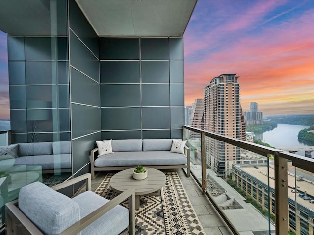 balcony with a water view and a city view