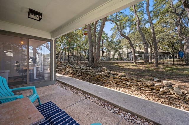 view of patio / terrace featuring fence