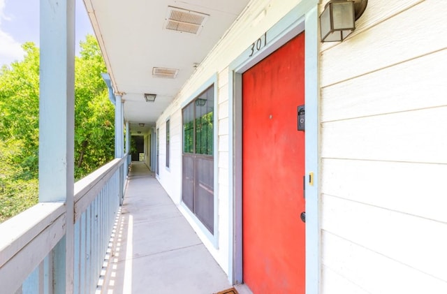 entrance to property featuring visible vents and elevator