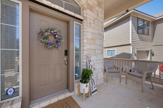 doorway to property featuring stone siding