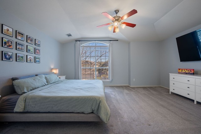 bedroom with carpet, visible vents, a ceiling fan, vaulted ceiling, and baseboards