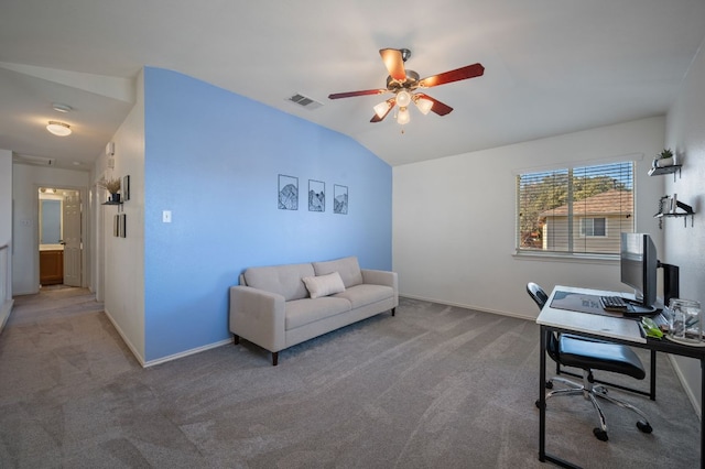 office area featuring carpet, visible vents, lofted ceiling, and baseboards