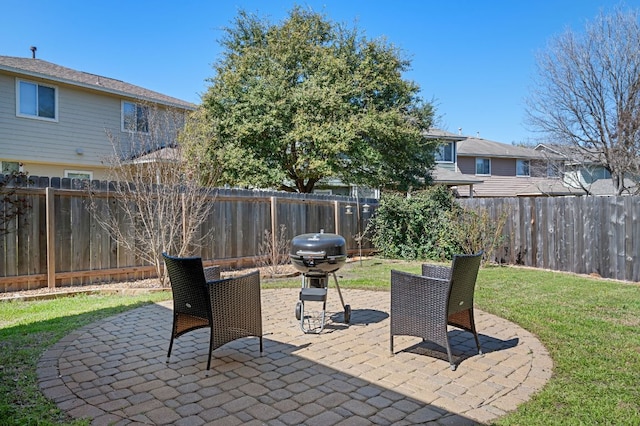 view of patio featuring a fenced backyard and a grill