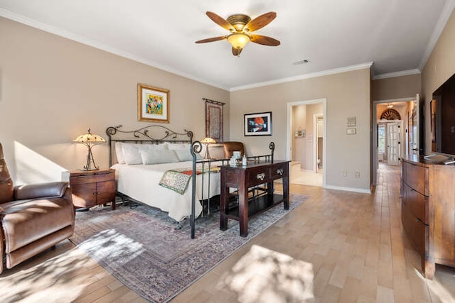 bedroom with light wood-style flooring, visible vents, ornamental molding, and baseboards