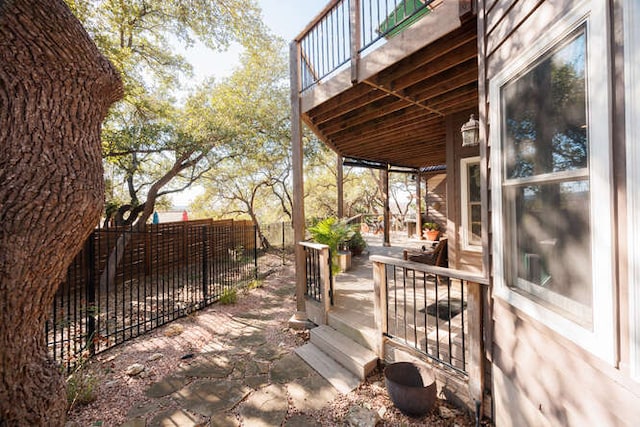 deck featuring a patio area and a fenced backyard