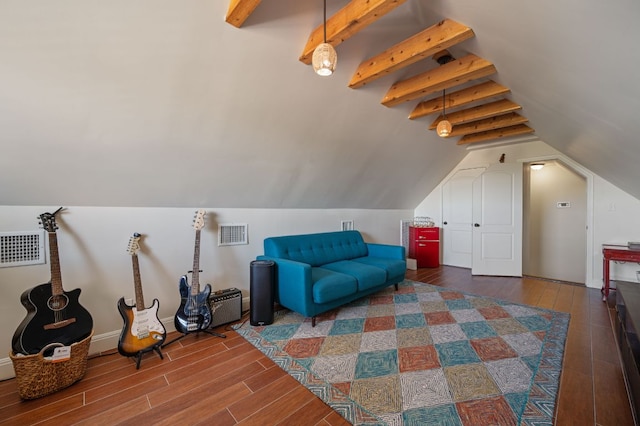 additional living space with lofted ceiling with beams, visible vents, and wood finished floors