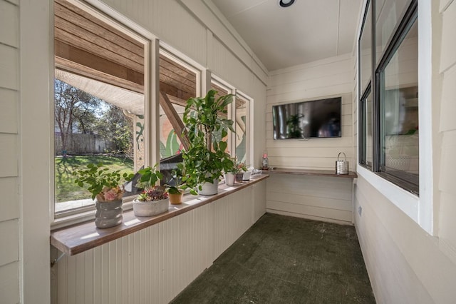 unfurnished sunroom featuring plenty of natural light