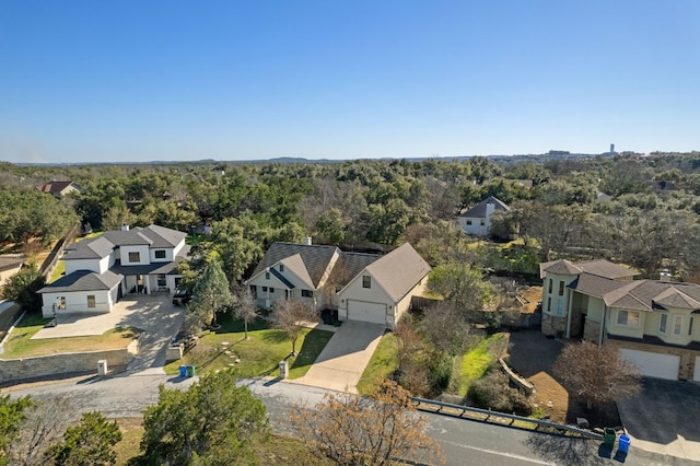 birds eye view of property featuring a forest view and a residential view