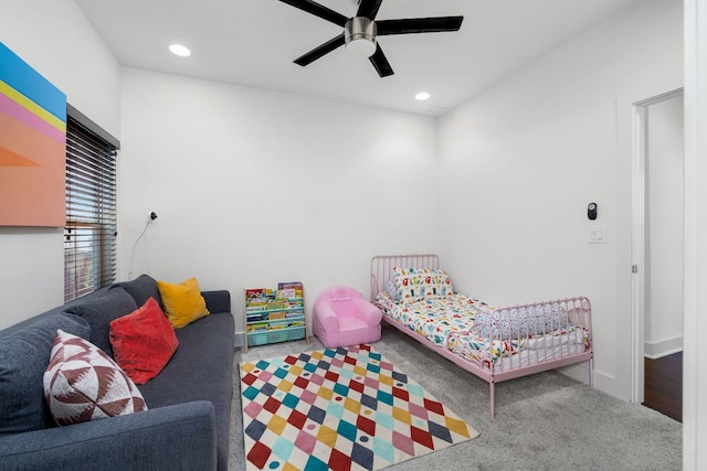 carpeted bedroom with ceiling fan and recessed lighting