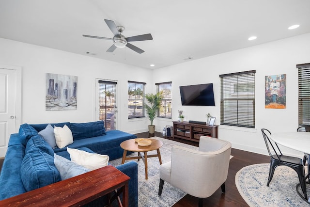 living area featuring recessed lighting, visible vents, baseboards, a ceiling fan, and dark wood finished floors