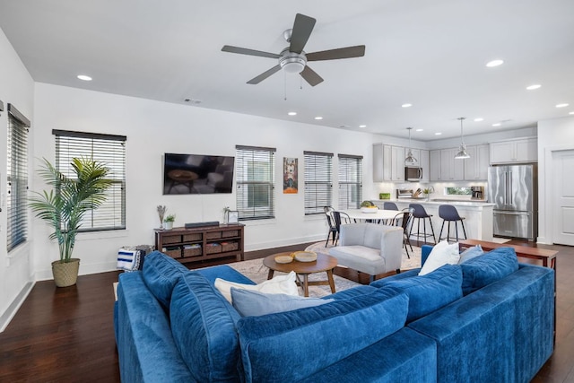 living room with recessed lighting, dark wood finished floors, baseboards, and ceiling fan