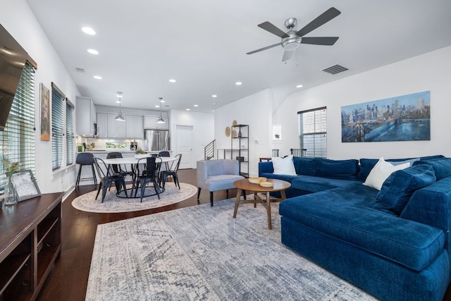 living area with ceiling fan, visible vents, wood finished floors, and recessed lighting