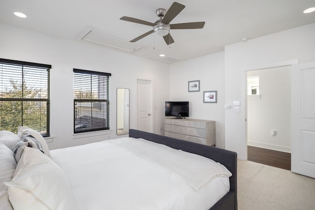 bedroom featuring attic access, recessed lighting, wood finished floors, and a ceiling fan