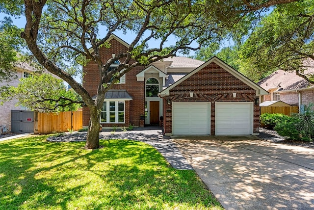 traditional-style home featuring concrete driveway, brick siding, fence, and an attached garage