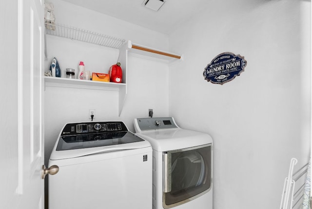 laundry area featuring laundry area, visible vents, and washer and dryer