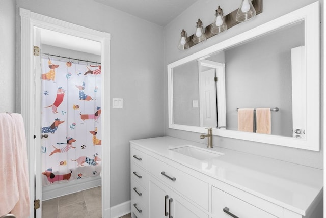 bathroom featuring vanity and baseboards