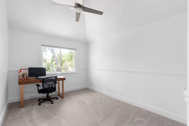 office with vaulted ceiling, carpet floors, a ceiling fan, and baseboards