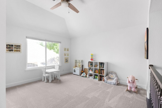 playroom featuring a ceiling fan, baseboards, vaulted ceiling, and carpet flooring