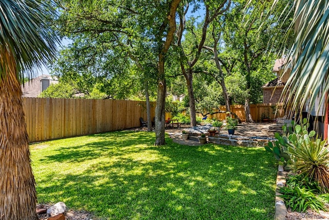 view of yard with a fenced backyard