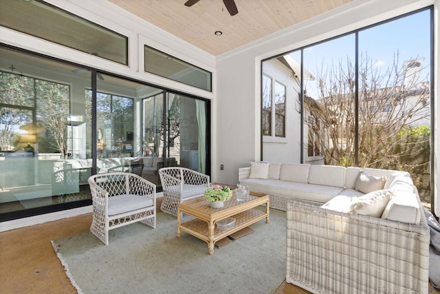 sunroom featuring wood ceiling and ceiling fan