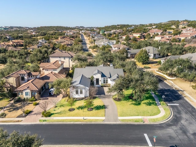 birds eye view of property with a residential view