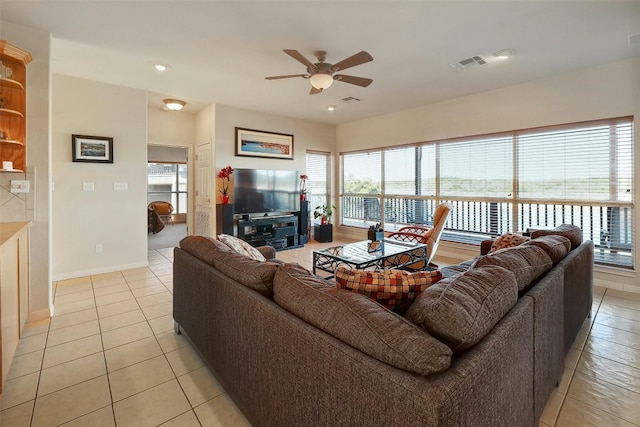 living room with ceiling fan, light tile patterned flooring, recessed lighting, visible vents, and baseboards