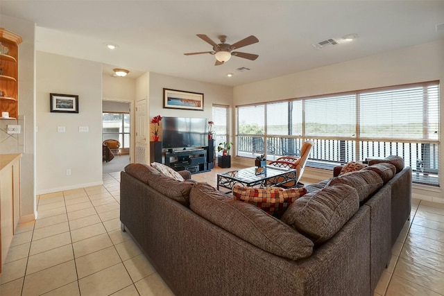 2802 Truman Cv, Lago Vista, TX 78645 - living area with a ceiling fan, light tile patterned floors, healthy amount of natural light, and recessed lighting
