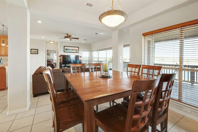 2802 Truman Cv, Lago Vista, TX 78645 - dining room featuring light tile patterned floors, baseboards, ceiling fan, and recessed lighting